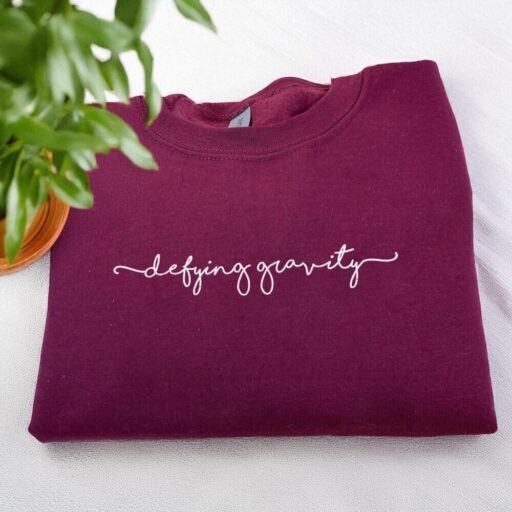 Defying Gravity Wicked Musical Embroidered Sweatshirt Elphaba And Glinda Wicked Sweatshirt Wicked Hoodie 3 512x512 2.jpg